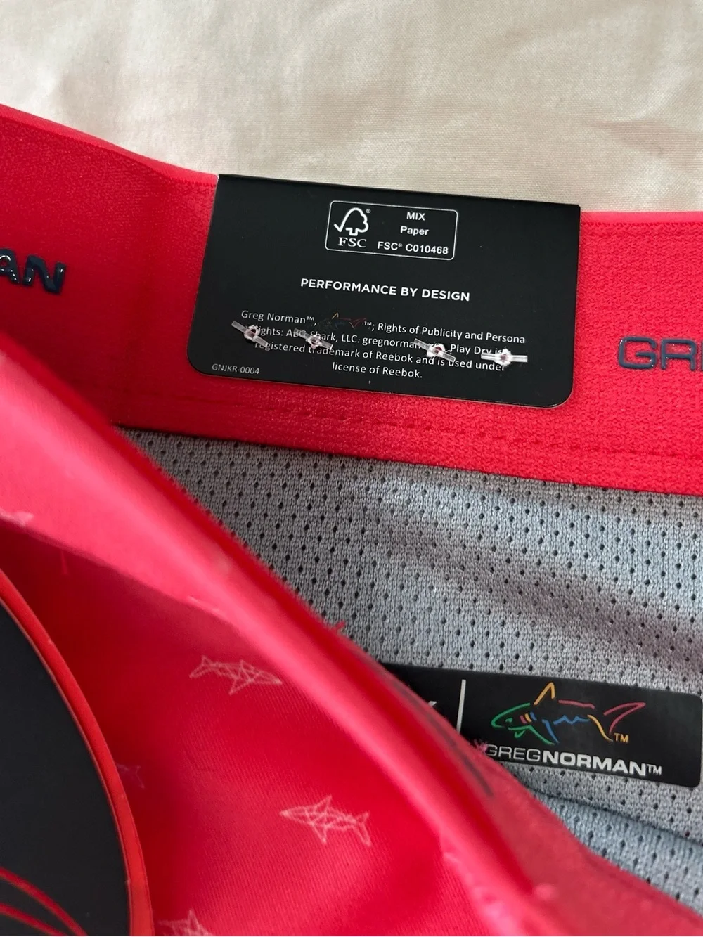 NWT Greg Norman Golf Shorts Men’s  36 Coral Pink AOP Shark Print Stretch